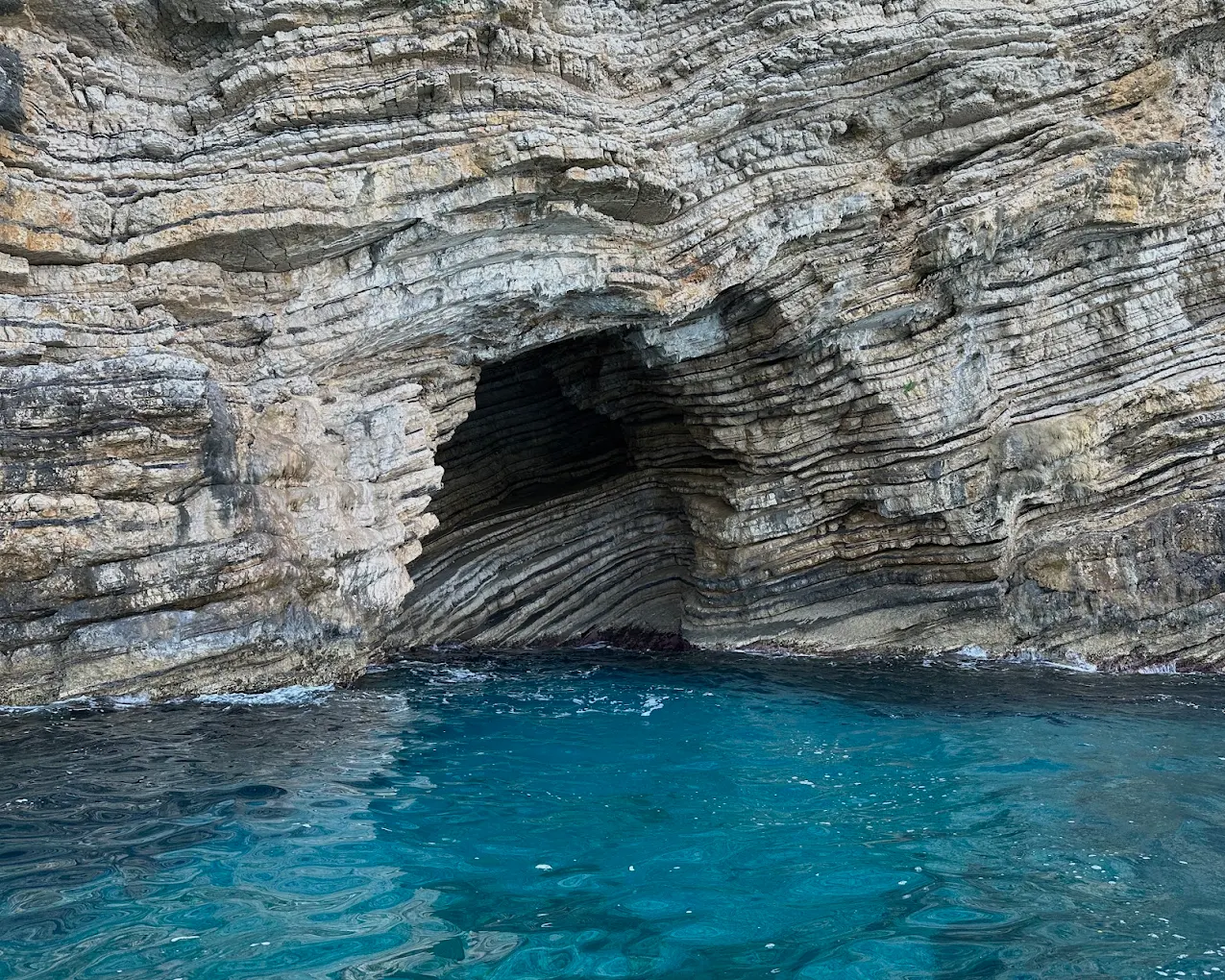 The mouth of the Blue Eye sea cave, cut into the limestone of the Paleokastritsa coast.